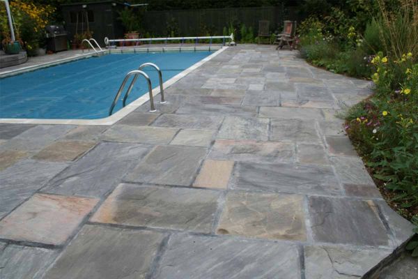 Single Tumbled Black Indian sandstone slab seen from above, showing riven surface texture and markings. Free UK delivery available.***