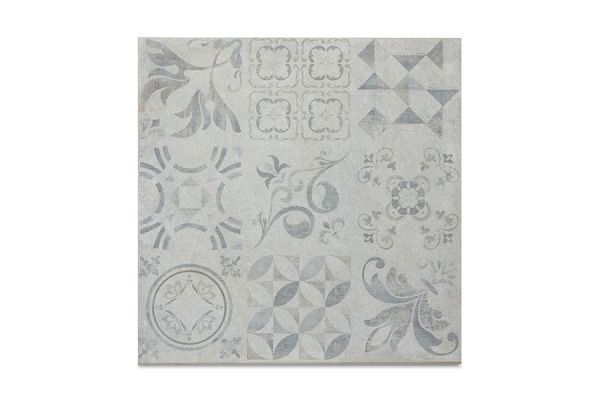Close-up swatch of Deco 600x600 Porcelain Paving, featuring a patchwork of geometric and floral patterns in soft grey tones.***