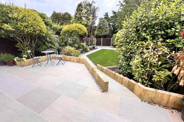 View of 1 print of 32 Raj Green Porcelain Paving slabs, showcasing natural stone veining in varying shades. Garden Tiles UK with free delivery.***
