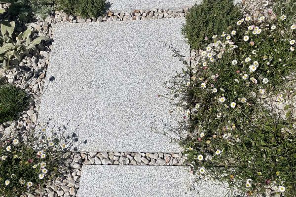 Single Silver Grey granite slab seen from above, showing even surface texture and speckled markings. Free UK delivery available.***