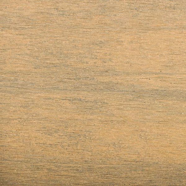 view from above of warm teak brushed composite decking uk, showing off texture and colour.***